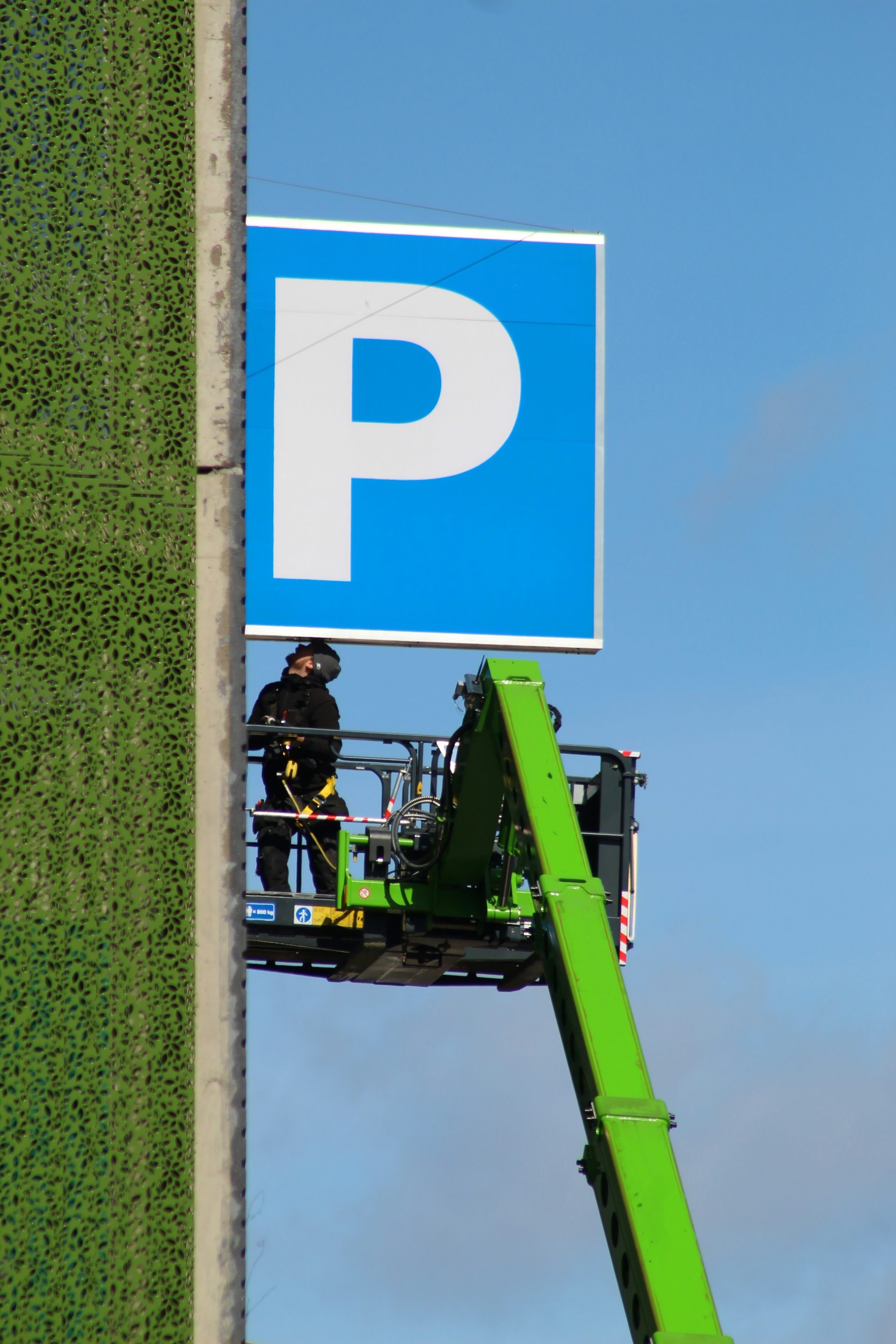 a person on a green tractor